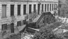 Detailed view of the Histoic orphanage before the renovation. The outside staircase is not accessible and windows are nailed with wood. 