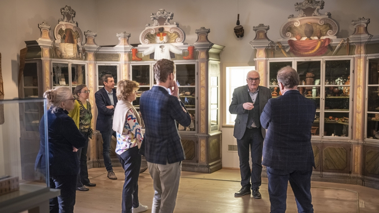 Members of the Alliance of Early Universal Museums learn about the history of the Wunderkammer in Halle during a guided tour with the director.