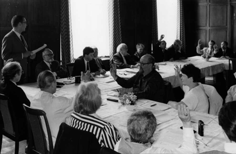The founding members of the Association of Friends sit at the table in the Chernishevsky House and vote unanimously on the statutes. 